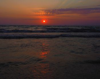 Scenic view of sea against romantic sky at sunset