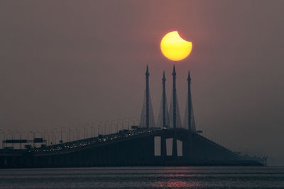 View of suspension bridge at sunset