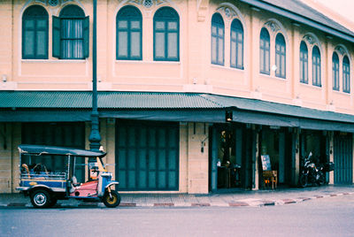 Car on street against building