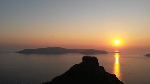 Scenic view of sea against sky at sunset