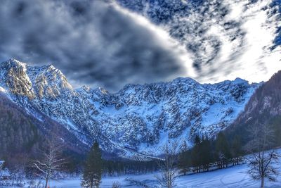 Scenic view of snowcapped mountains against sky