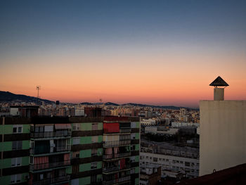 High angle view of buildings against sky during sunset