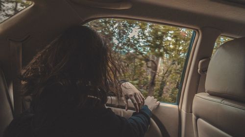 Woman sitting in car