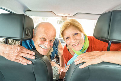 Portrait of senior couple in car