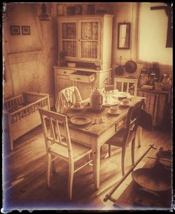 Empty chairs and tables in building