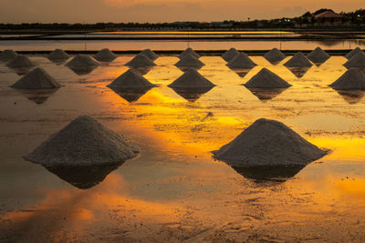 Salt in the salt fields in the evening during the shoveling of salt 