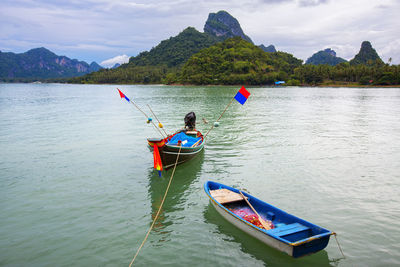 Boats moored in river 