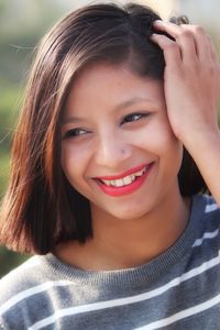 Close-up of smiling young woman