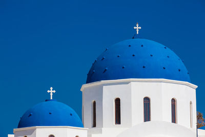 The church of holy cross in the central square of perissa on santorini island