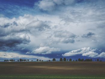 Scenic view of landscape against cloudy sky