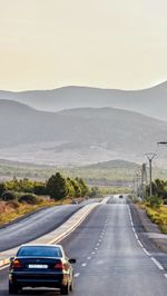 Car on country road against sky