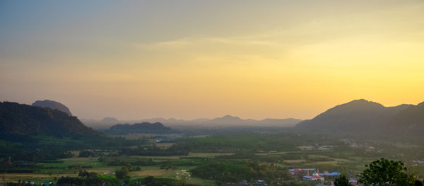 Scenic view of mountains against sky during sunset