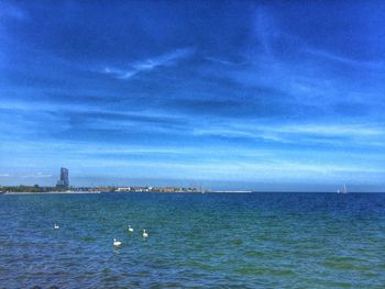 Scenic view of sea against cloudy sky