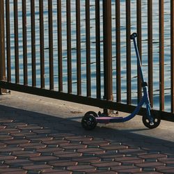 Close-up of bicycle against wall