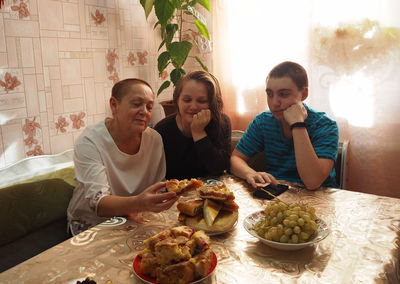 Group of people sitting on table