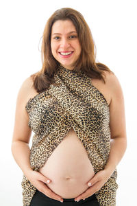 Portrait of smiling young woman against white background