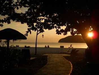 Scenic view of beach against sky during sunset