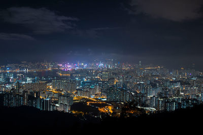 High angle view of illuminated buildings in city at night