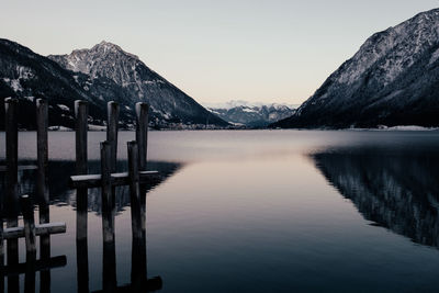 Scenic view of lake and mountains against sky