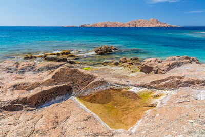 Scenic view of sea against clear blue sky