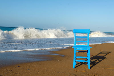 Seascape with a chair. the concept of a holiday by the sea