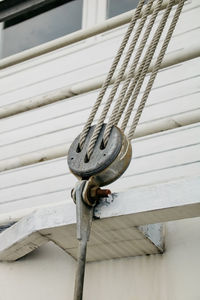 Close-up of rope tied on wood