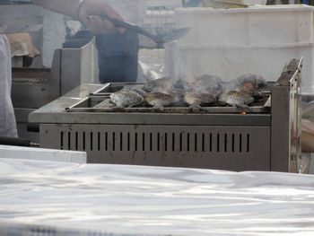 Man preparing food on barbecue grill