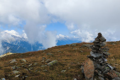 Scenic view of mountains against cloudy sky