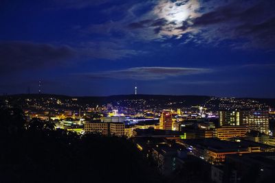 Aerial view of city lit up at night