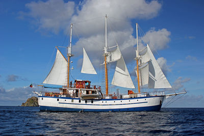 Ship in sea against blue sky