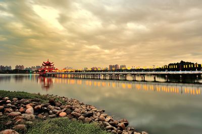 Built structure on water against sky