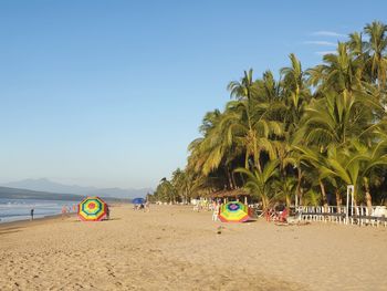 Scenic view of beach against clear sky