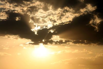 Low angle view of cloudy sky at sunset