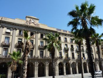 Low angle view of building against blue sky