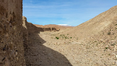 Scenic view of rocky landscape against blue sky