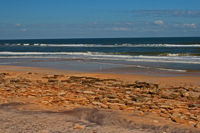 Scenic view of beach against sky