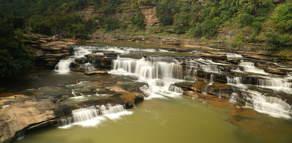 Scenic view of waterfall in forest