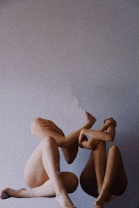 Low section of woman with rope on floor