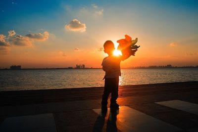 Scenic view of sea at sunset