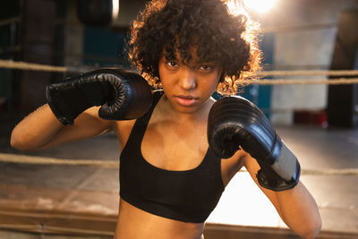 Young woman exercising in gym