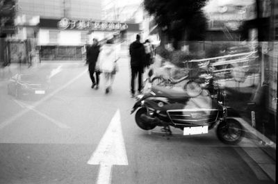 People walking on road in city