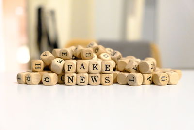 Close-up of text on toy blocks on table