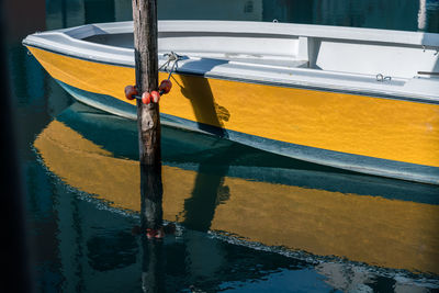 High angle view of boat moored in canal.