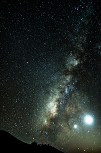 Low angle view of stars in sky at night