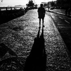 Woman walking on road