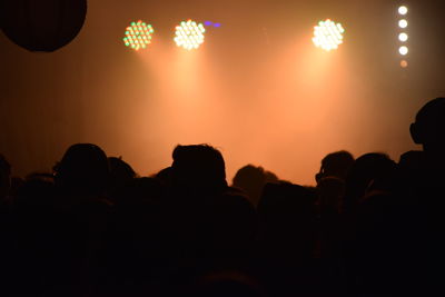 Silhouette people at music concert