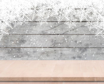 Close-up of snowflakes on hardwood floor