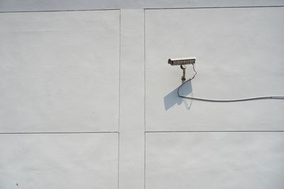 Close-up of electric lamp on wall