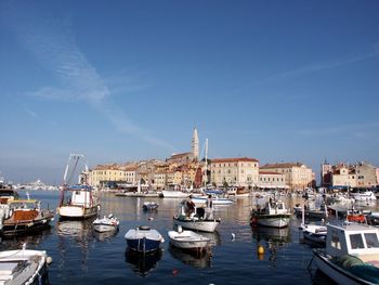 Boats moored at harbor