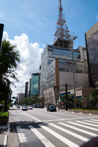 City street and buildings against sky